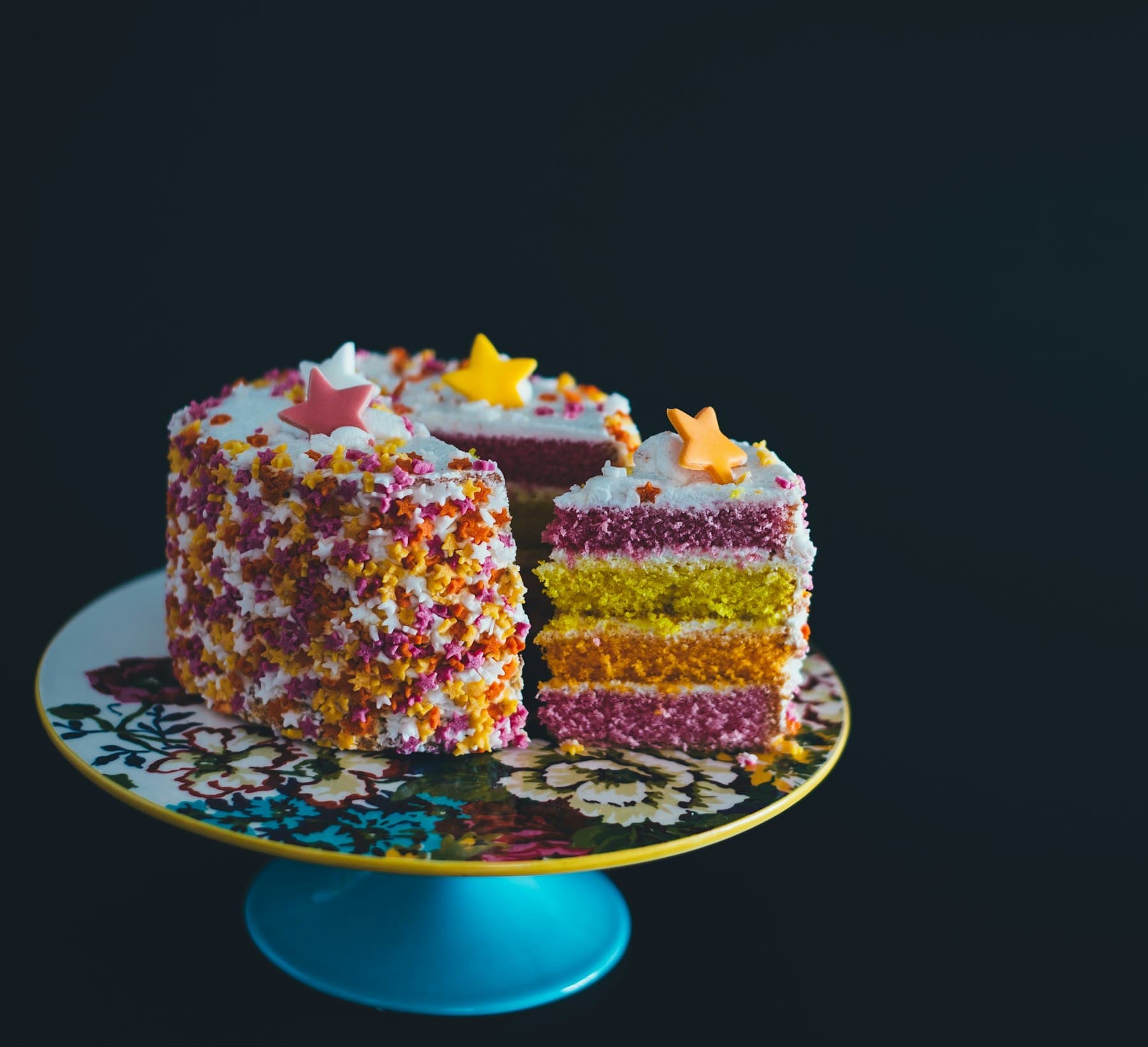 Layered celebration cake decorated with sprinkles
