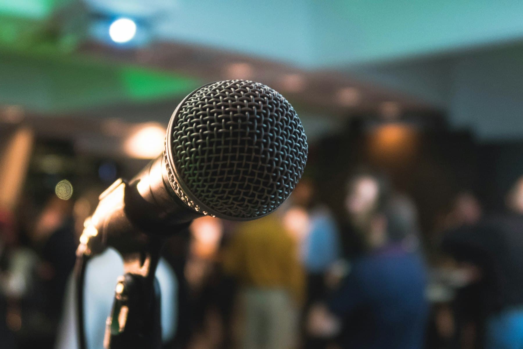 Microphone in front of guests at an evening event