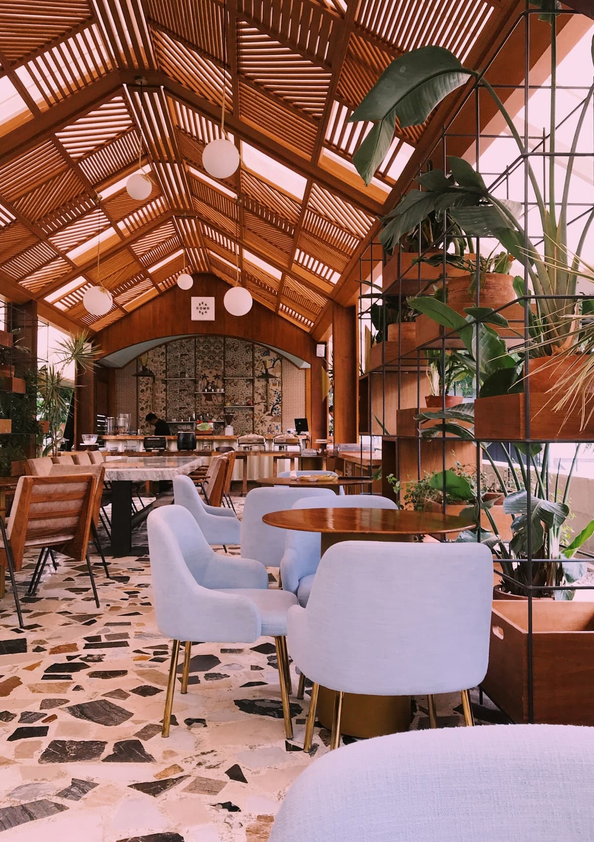 Warmly lit indoor venue with tables and chairs arranged for guests